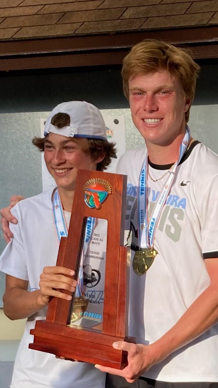 Grant Price and Adam Logan with the state championship trophy.